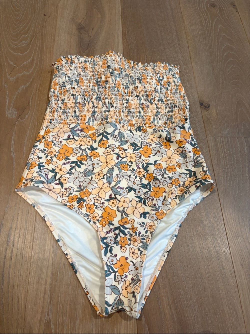 Size Medium Smocked Floral One-Piece Swimsuit in Yellow and Cream.